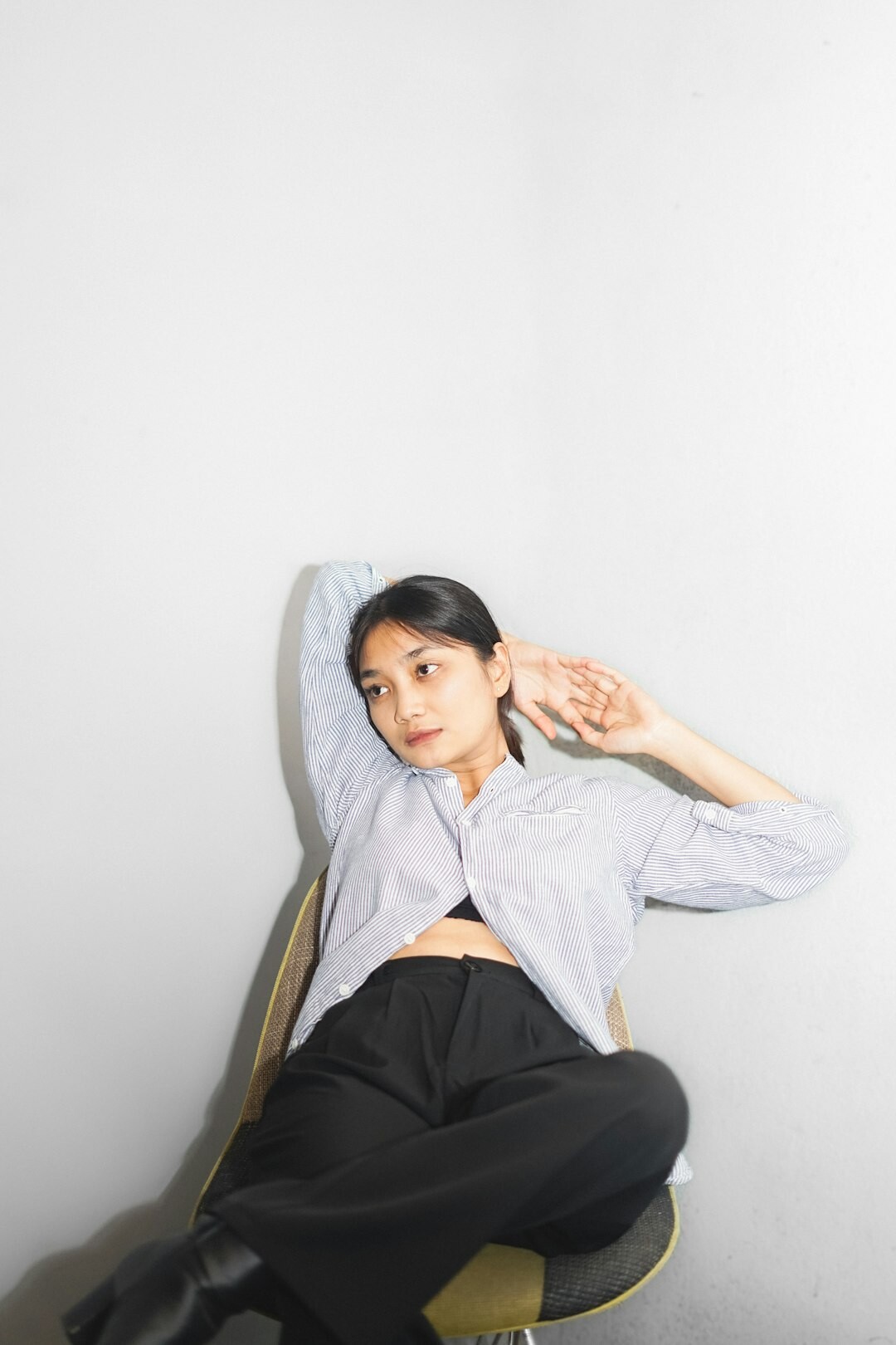 Studio portrait of a confident Asian woman in business casual attire