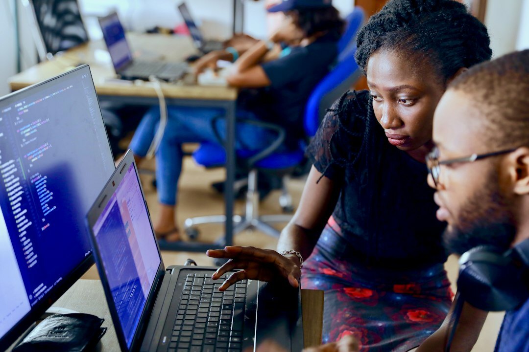 group of students coding together